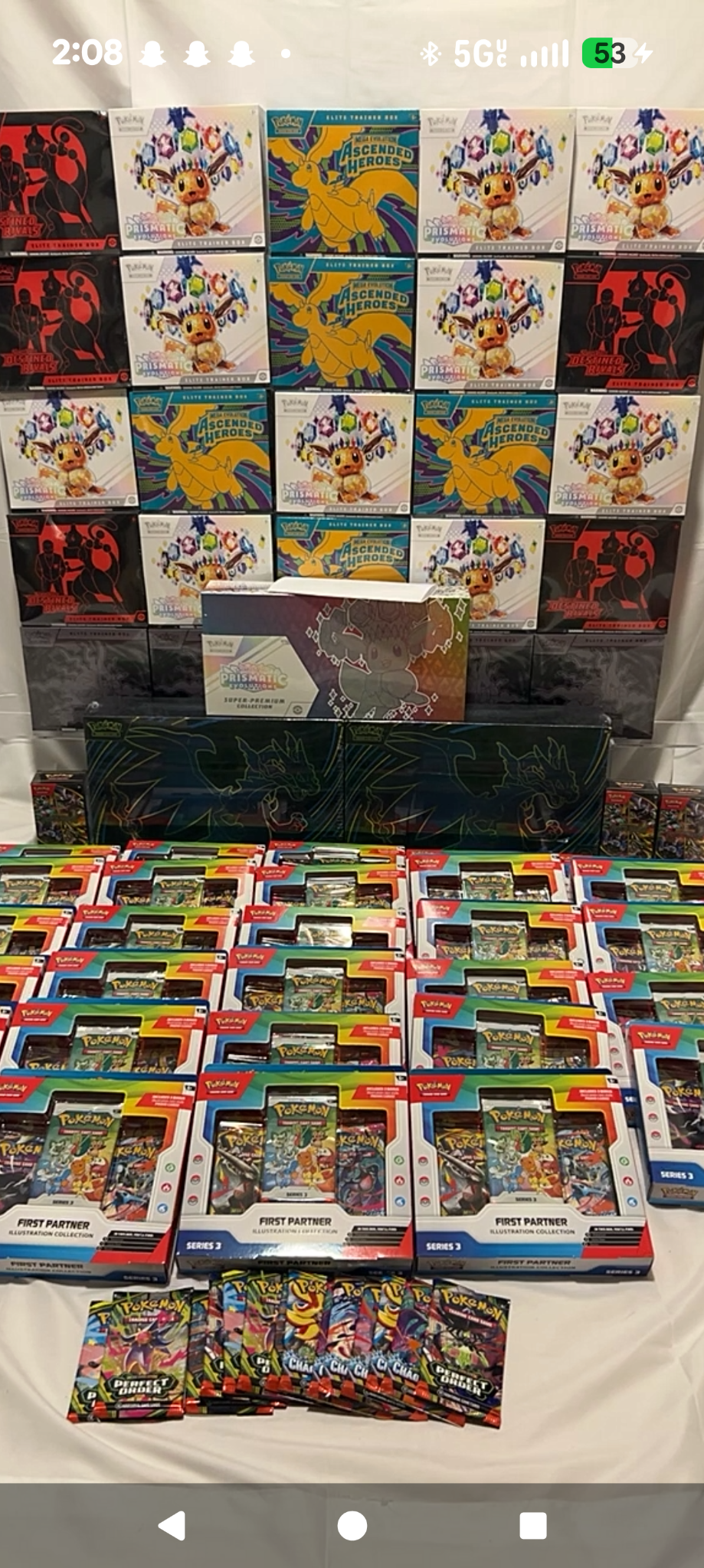 Pokémon sealed products, collection boxes, and booster packs arranged for sale